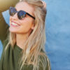 Cheerful young woman in sunglasses