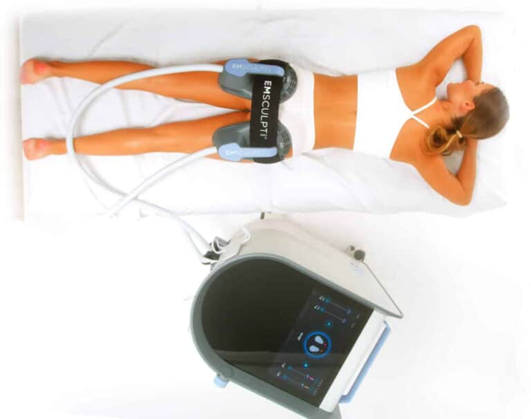woman laying on stomach undergoing emsculpt non-surgical body contouring with device on buttocks
