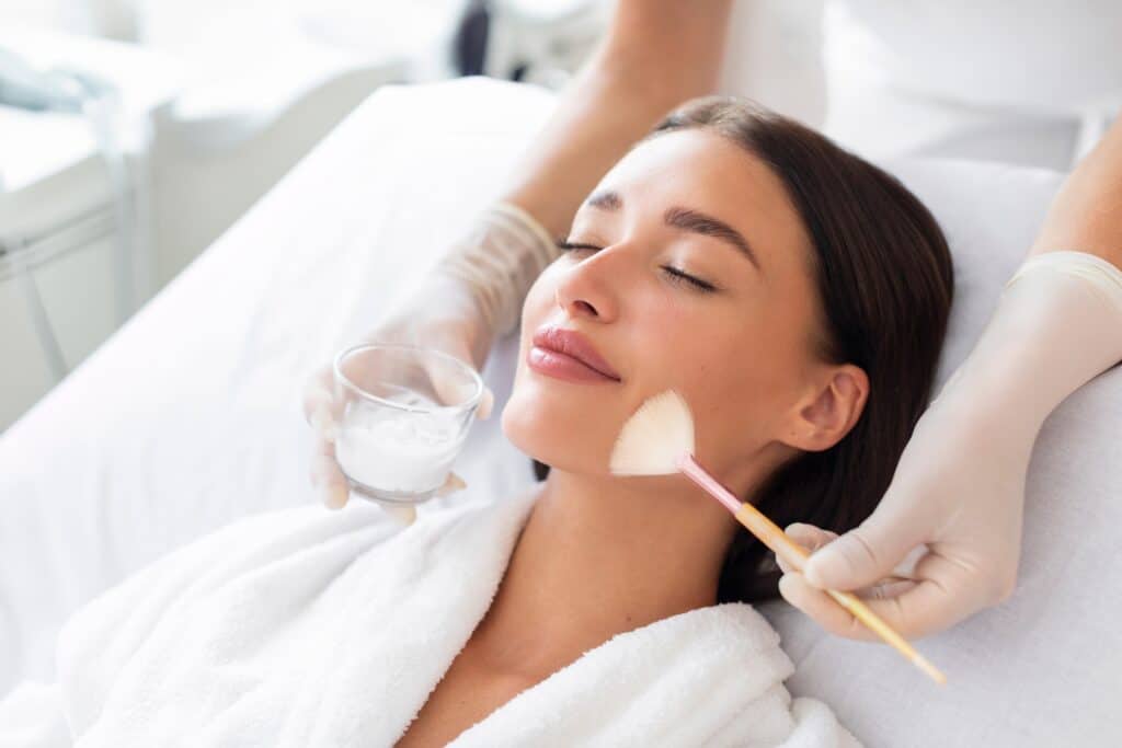 Woman relaxing with eyes closed while getting a chemical peel in San Antonio