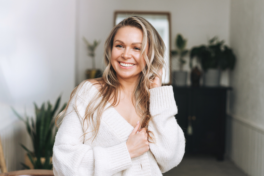 Woman with glowing skin after DermaV skin treatment.