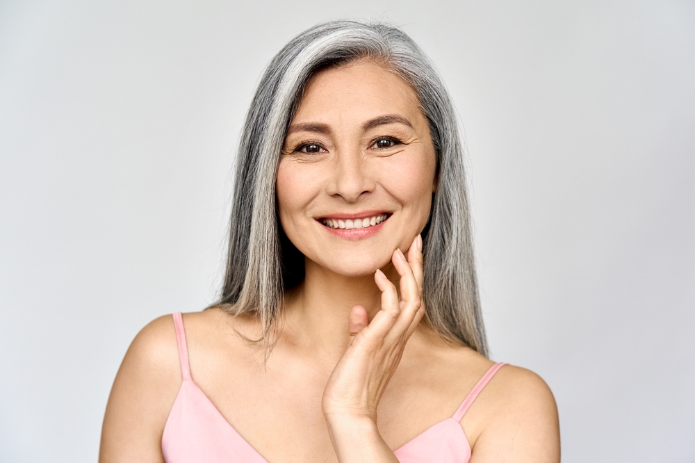 Beautiful mature woman with nicely shaped chin and jawline after filler treatment.