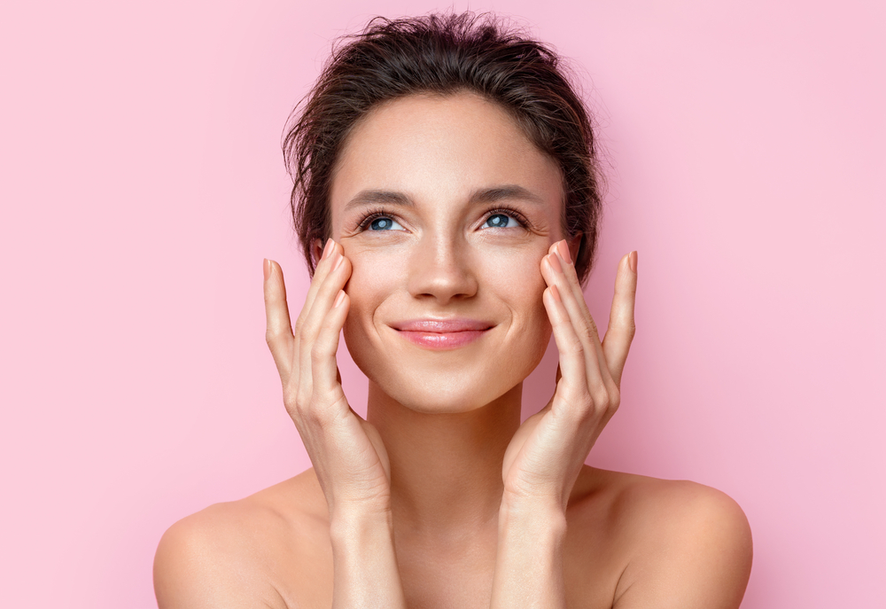 Woman smiling after BOTOX treatment.
