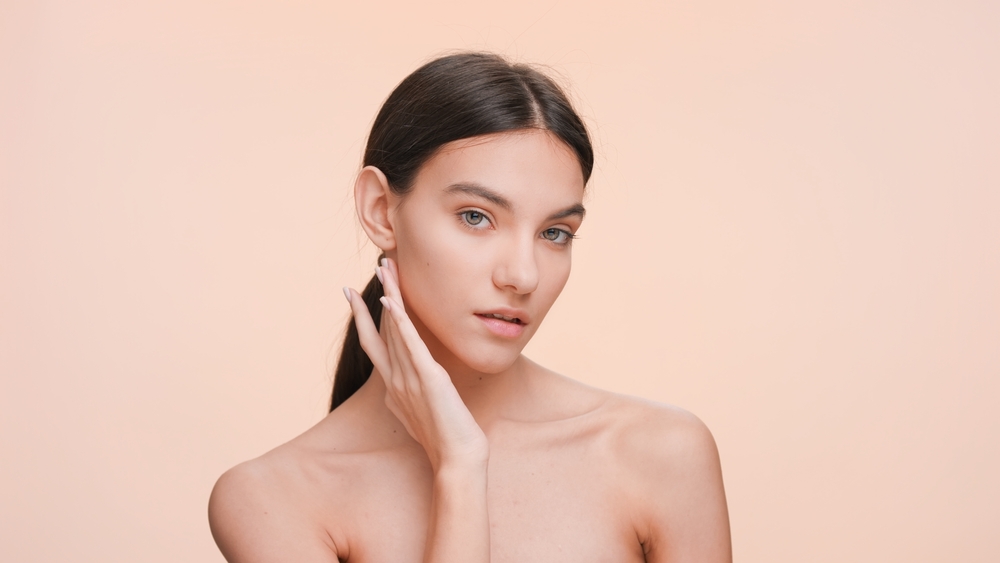 Woman showing a firmer jawline after Ultherapy treatment.
