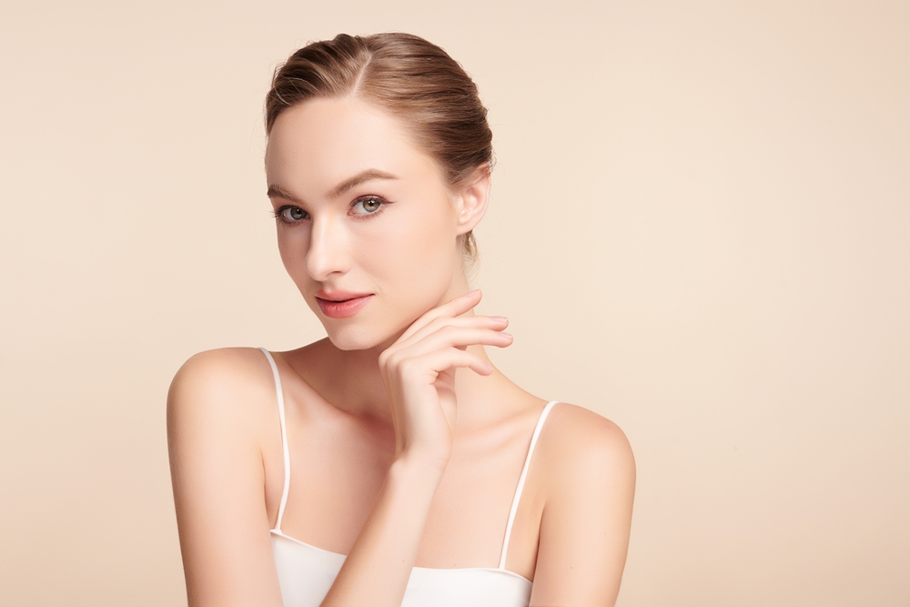 Woman with smooth skin after a liquid facelift treatment.