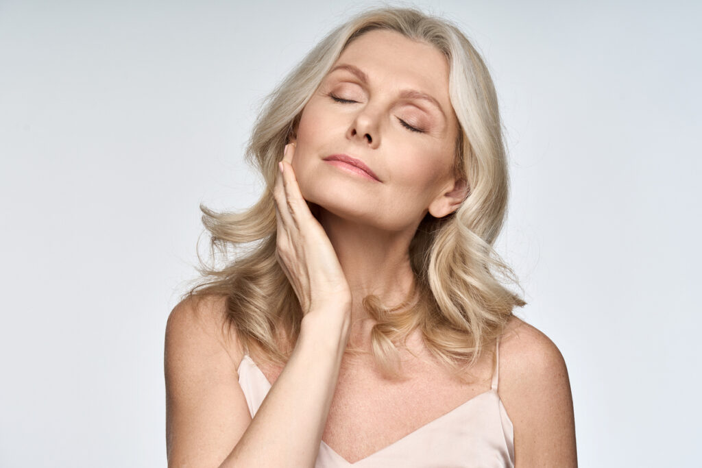 Woman with smooth, firm facial skin after skin tightening treatment.
